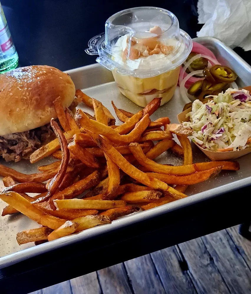 Pulled Pork Sandwich Fries Cole Slaw and Banana Pudding